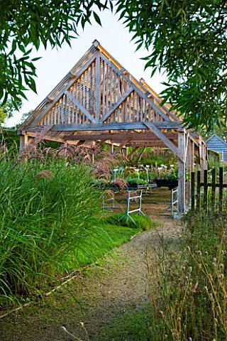 MARCHANTS_HARDY_PLANTS_EAST_SUSSEX_THE_NURSERY__TIMBER_SHELTER_WITH_LATH_ROOF_WOOD