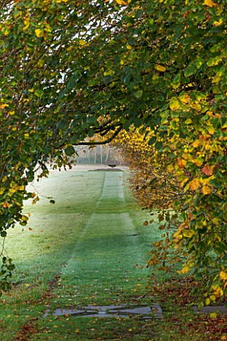 HOLKER_HALL__CUMBRIA_VIEW_OF_A_PATH_THROUGH_THE_WILDFLOWER_MEADOW_TO_THE_ROCK_AND_SUNDIAL__IN_AUTUMN