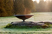 HOLKER HALL  CUMBRIA: THE ROCK AND SUNDIAL IN AUTUMN ON A FROSTY MORNING