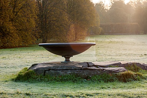 HOLKER_HALL__CUMBRIA_THE_ROCK_AND_SUNDIAL_IN_AUTUMN_ON_A_FROSTY_MORNING
