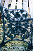 SEDGWICK PARK, WEST SUSSEX. DETAIL OF FROSTED METAL BENCH WITH FLORAL DESIGN. WINTER, A PLACE TO SIT, JANUARY.