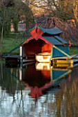 CHIPPENHAM PARK, CAMBRIDGESHIRE: THE BOAT HOUSE REFLECTED IN THE LAKE. REFLECTION,  WINTER