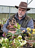 HAZLES CROSS FARM: MIKE BYFORD COLLECTION OF HELLEBORES - MIKE BYFORD WITH CAT