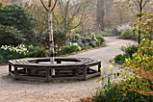 THE NATIONAL TRUST - DUNHAM MASSEY, CHESHIRE: THE WINTER GARDEN - PATH AND WOODEN TREE SEAT - A PLACE TO SIT