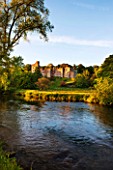 HADDON HALL, DERBYSHIRE: THE HALL WITH THE RIVER WYE IN FRONT OF IT - EVENING LIGHT, JUNE