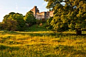 HADDON HALL, DERBYSHIRE: THE HALL SEEN FROM THE MEADOW BELOW - EVENING LIGHT, JUNE
