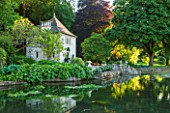 ABLINGTON MANOR  GLOUCESTERSHIRE: VIEW ACROSS THE RIVER COLN TO GAZEBO / SUMMER HOUSE IN FRENCH STYLE - CLASSIC COUNTRY GARDEN  ROMANCE  ROMANTIC  SUMMER  JUNE