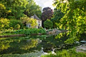 ABLINGTON MANOR  GLOUCESTERSHIRE: VIEW ACROSS RIVER COLN TO FRENCH STYLE GAZEBO / SUMMER HOUSE  CLASSIC COUNTRY GARDEN  SUMMER  JUNE  ROMANCE  ROMANTIC