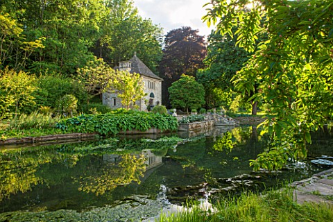 ABLINGTON_MANOR__GLOUCESTERSHIRE_VIEW_ACROSS_RIVER_COLN_TO_FRENCH_STYLE_GAZEBO__SUMMER_HOUSE__CLASSI