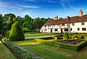 LITTLE MYNTHURST FARM, SURREY: THE HOUSE WITH FORMAL KNOT GARDEN. TOPIARY, CLIPPED, BOX, EDBGED, BEDS, GRASS, LAWN
