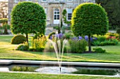 PRIVATE GARDEN, GLOUCESTERSHIRE - DESIGNER ANGEL COLLINS - CANAL, POOL, FOUNTAIN, WATER, LAWN, HOUSE, COUNTRY, HOUSE, CLIPPED, HORNBEAM, TOPIARY, FORMAL
