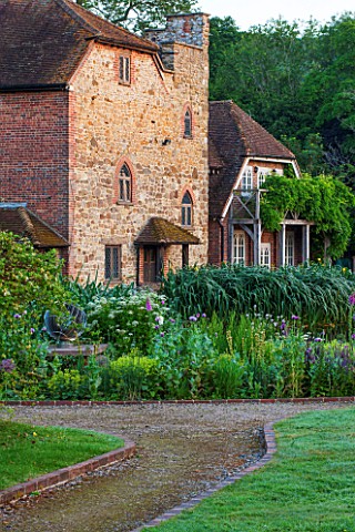 OLD_NETLEY_MILL_SHERE_SURREY_BORDER_IN_FRONT_OF_THE_MILL_WITH_SISYRINCHIUM_SHIRLEY_POPPIES_AND_ALCHE