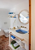 CIUTADELLA MENORCA, SPAIN: EVELYNE MANDEL HOUSE - BATHROOM IN BLUE AND WHITE - MIRROR, SINK, WASHBASIN, WASH BASIN, TAPS, LIGHT, SOAP, TOILET