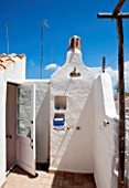 CIUTADELLA MENORCA, SPAIN: EVELYNE MANDEL HOUSE - WHITE PAINTED WALLS - OUTDOOR SHOWER ON ROOF TOP TERRACE