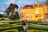 LAMPORT HALL, NORTHAMPTONSHIRE: VIEW OF THE BACK OF THE HALL AT SUNRISE WITH THE ITALIAN GARDEN - FOUNTAIN, PARTERRE, BOX,, GRAVEL, HOUSE, SKY, AUGUST, BUILDING, FORMAL