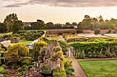 LAMPORT HALL, NORTHAMPTONSHIRE: AERIAL VIEW OF THE WALLED CUTTING FLOWER GARDEN WITH THE ROCKERY GARDEN IN THE FOREGROUND. FORMAL, HISTORIC, CLASSIC ENGLISH GARDEN