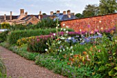 LAMPORT HALL, NORTHAMPTONSHIRE: THE HALL SEEN FROM THE WALLED KITCHEN GARDEN - CUTTING GARDEN - JOE PYE WEED, HOLLYHOCKS, AGAPANTHUS - FLOWERS, SUMMER, COUNTRY GARDEN