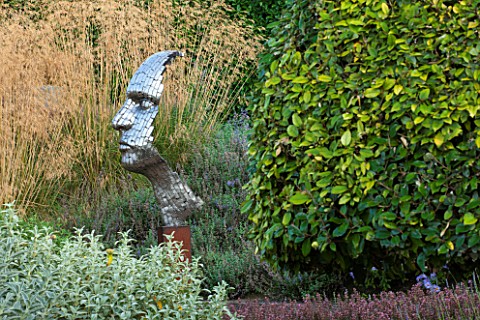 SURREY_GARDEN_DESIGNED_BY_ANTHONY_PAUL_FOCAL_POINT__PIXELATED_STYLE_STEEL_HEAD_BY_RICK_KIRBY_WITH_ST