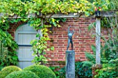 SURREY GARDEN DESIGNED BY ANTHONY PAUL: TERRACE WITH STATUE, BRICK WALL AND PERGOLA - PATIO, SUMMER, COUNTRY GARDEN, FORMAL, SEPTEMBER
