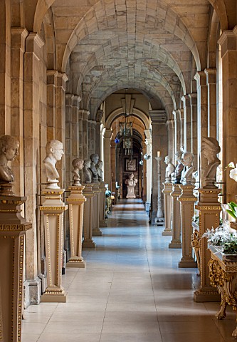 CASTLE_HOWARD_YORKSHIRE_CHRISTMAS__THE_ANTIQUE_PASSAGE_DECORATED_AT_CHRISTMAS_WITH_WHITE_ORCHIDS__DE