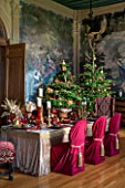 CASTLE HOWARD, YORKSHIRE: CHRISTMAS - DINING ROOM IN THE HIGH SALOON DECORATED FOR CHRISTMAS WITH CANDLES, CHRISTMAS TREES AND FESTIVE DECORATIONS - DECORATIVE, ORNAMENT, WINTER