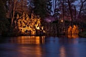 PAINSHILL PARK, SURREY: THE CRYSTAL GROTTO  LIT UP AT NIGHT - LIGHTING, FOLLY, FOLLIES, HISTORIC, LAKE, WATER, LANDSCAPE, WINTER, DECEMBER, CHRISTMAS, REFLECTION, REFLECTIONS