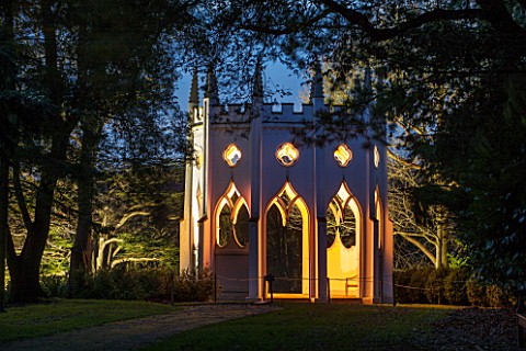 PAINSHILL_PARK_SURREY_THE_GOTHIC_TOWER_LIT_UP_AT_NIGHT__LIGHTING_HISTORIC_LANDSCAPE_WINTER_DECEMBER_