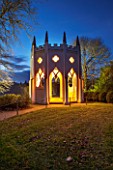 PAINSHILL PARK, SURREY: THE GOTHIC TOWER LIT UP AT NIGHT - LIGHTING, HISTORIC, LANDSCAPE, WINTER, DECEMBER, CHRISTMAS, FOLLY, BUILDING