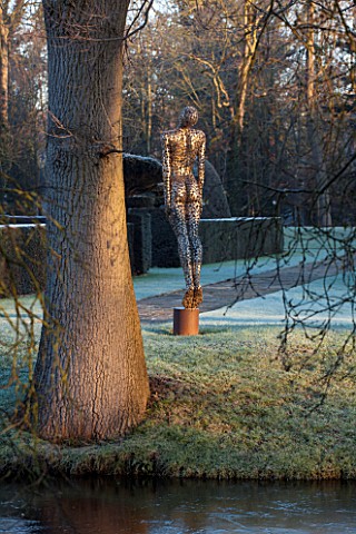 GREAT_FOSTERS_SURREY_SOARING_FIGURE__SCULPTURE_IN_STAINLESS_STEEL_BY_RICK_KIRBY_BESIDE_THE_MOAT__WAT