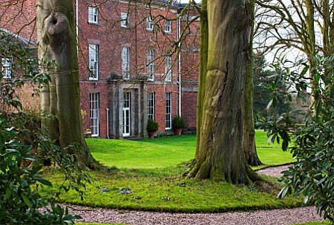 RODE_HALL_AND_GARDENS_CHESHIRE_THE_HALL_WITH_LAWN_AND_TREES