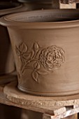 WHICHFORD POTTERY, WARWICKSHIRE: THE TUDOR ROSE DESIGN ON QUEENS 90TH BIRTHDAY TERRACOTTA CONTAINER IN WORKSHOP