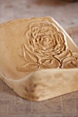 WHICHFORD POTTERY, WARWICKSHIRE: TUDOR ROSE MOULD FOR QUEENS 90TH BIRTHDAY TERRACOTTA CONTAINER IN WORKSHOP