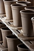WHICHFORD POTTERY, WARWICKSHIRE: NEWLY THROWN TERRACOTTA CONTAINERS DRYING OUT IN THE WORKSHOP