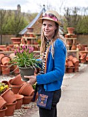 WHICHFORD POTTERY, WARWICKSHIRE: KYLIE COBB- STAINER HOLDING CONTAINER OF TULIPS
