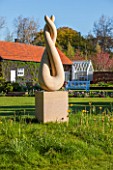 ULTING WICK, ESSEX: SCULPTURE IN THE GARDEN IN APRIL - LAWN, GREENHOUSE, STONE, ART,  SPRING