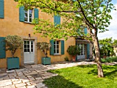 LA JEG, PROVENCE, FRANCE: DESIGNER ANTHONY PAUL - COURTYARD, HOUSE, LAWN, PAVING, STONE, PATH, VERSAILLES CONTAINER, SPRING, MEDITERRANEAN