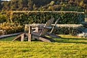 LA JEG, PROVENCE, FRANCE: DESIGNER ANTHONY PAUL - TWO WOODEN ADIRONDACK CHAIRS. SEAT, SEATING, BENCH, LOUNGER, LOUNGERS, MEDITERRANEAN, GARDEN, GREEN, PROVENCE, MAY