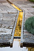 LA JEG, PROVENCE, FRANCE: DESIGNER ANTHONY PAUL - WALLED GARDEN WITH RILL. PAVING, STONE, MEDITERRANEAN, WATER, GARDEN, SPRING, MAY