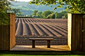 BRYANS GROUND, HEREFORDSHIRE: BRIDIES LIGHTBOX - NAMED AFTER A FELL TERRIER BORN IN 2008 - WOOD STRUCTURE WITH BENCH ON DECK - VIEW TO OPEN FARMLAND - BORROWED LANDSCAPE