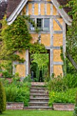 BRYANS GROUND, HEREFORDSHIRE: VIEW OF STEPS AND DOVECOTE DESIGNED BY SIMON DORRELL - BUILDING, COUNTRY GARDEN, ARTS AND CRAFTS, MAY, SPRING, FOLLY, SUMMER HOUSE, SUMMERHOUSE