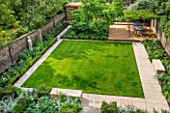 PRIVATE GARDEN LONDON DESIGNED BY LUCY WILLCOX AND ANA SANCHEZ MARTIN: VIEW FROM HOUSE DOWN ONTO TOWN GARDEN WITH LAWN, PATHS, STATUE,WALLS, PERGOLA, BORDERS - JUNE, SUMMER, FORMAL