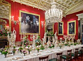 CHATSWORTH HOUSE,DERBYSHIRE: FLORABUNDANCE-THE GREAT DINING ROOM.BEAUTIFUL GRAND TABLE DECORATED WITH COTTAGE GARDEN BUNCHES OF SWEET PEAS,CORNFLOWERS,SWEET WILLIAM, ELEGANCE.