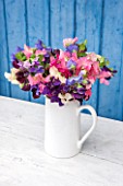 THE REAL FLOWER COMPANY: WHITE PORCELAIN JUG WITH MIXED SWEET PEAS. FRAGRANT,VINTAGE,PRETTY,SHABBY CHIC,FLOWERS,ARRANGEMENT,VASE,DISPLAY,PINK,PURPLE,LILAC.