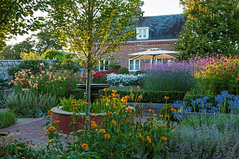 BELMONT_HOUSE_SUSSEX__DESIGN_ANTHONY_PAUL_WALLED_GARDEN_WATER_FEATURE_AGAPANTHUS_LILIES_COSMOS_MONAR