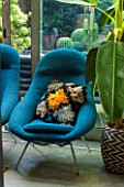ABIGAIL AHERN HOUSE, LONDON: THE LIVING ROOM - BLUE CHAIR WITH CUSHION - SITTING ROOM