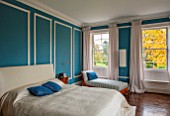 MORTON HALL, WORCESTERSHIRE: MASTER BEDROOM WITH EAST FACING WINDOWS. WALLS ARE FARROW & BALL CHINESE BLUE WITH MOULDINGS IN FB ALL WHITE. WOODEN FLOOR