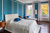 MORTON HALL, WORCESTERSHIRE: MASTER BEDROOM WITH EAST FACING WINDOWS. WALLS ARE FARROW & BALL CHINESE BLUE WITH MOULDINGS IN FB ALL WHITE. WOODEN FLOOR AND BEDSIDE TABLES
