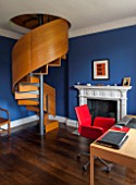 MORTON HALL, WORCESTERSHIRE: BEDROOM PAINTED FB DRAWING ROOM BLUE.19TH CENTURY FIREPLACE.SPIRAL STAIRCASE IN BRUSHED STEEL & SMOKED OAK BY CARL GEORG LUETCKE