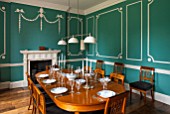MORTON HALL,WORCS:DINING ROOM WITH KEIM OPTIL MINERAL PAINT.ORIGINAL DRAWING ROOM OF C18TH HOUSE.ORIGINAL MOULDINGS,ANTIQUE EXTENDABLE ELM WOOD TABLE AND CHERRY WOOD CHAIRS