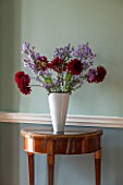 MORTON HALL, WORCESTERSHIRE: MAIN HALLWAY. FLORAL ARRANGEMENT ON MAHOGANY EMPIRE SEMI-CIRCULAR CONSOLE TABLE WITH MARBLE TOP CA.1800 FRENCH. FARROW & BALL PAINT